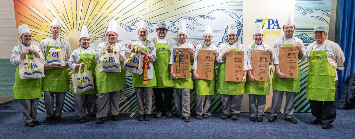 The Penn College contingent, displaying their School Cooking Challenge winnings. From left: Abigail G. Sollenberger, of Newville; Nicholas P. Matz, of Schuylkill Haven; Alyssa D. Perez, of Turbotville; Ally A. Colon, of Philadelphia; Madisen H. Donlin, of Breezedale; Chef Mike Dinan; Felicia D. Donnie, of Harrisburg; Kendal L. Johnson, of Scranton; Emma E. Delcampo, of West Chester; Emily Myers, of Catawissa; Luke C. Whipple, of Shamokin Dam; and Chef Michael J. Ditchfield.